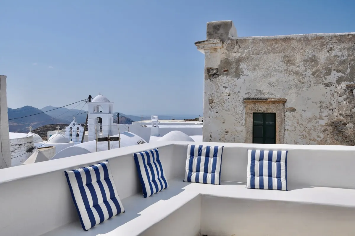 Chora House - The house sits in the middle of Chora village, surrounded by whitewashed streets and traditional charm. The terrace faces west for stunning sunsets and views over Katapola Bay.